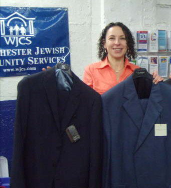 WJCS Kid’s Kloset Director Stephanie Roth with some of the new suits donated by Ken Giddon, owner of Rothman’s Men’s Clothing Store in Scarsdale.