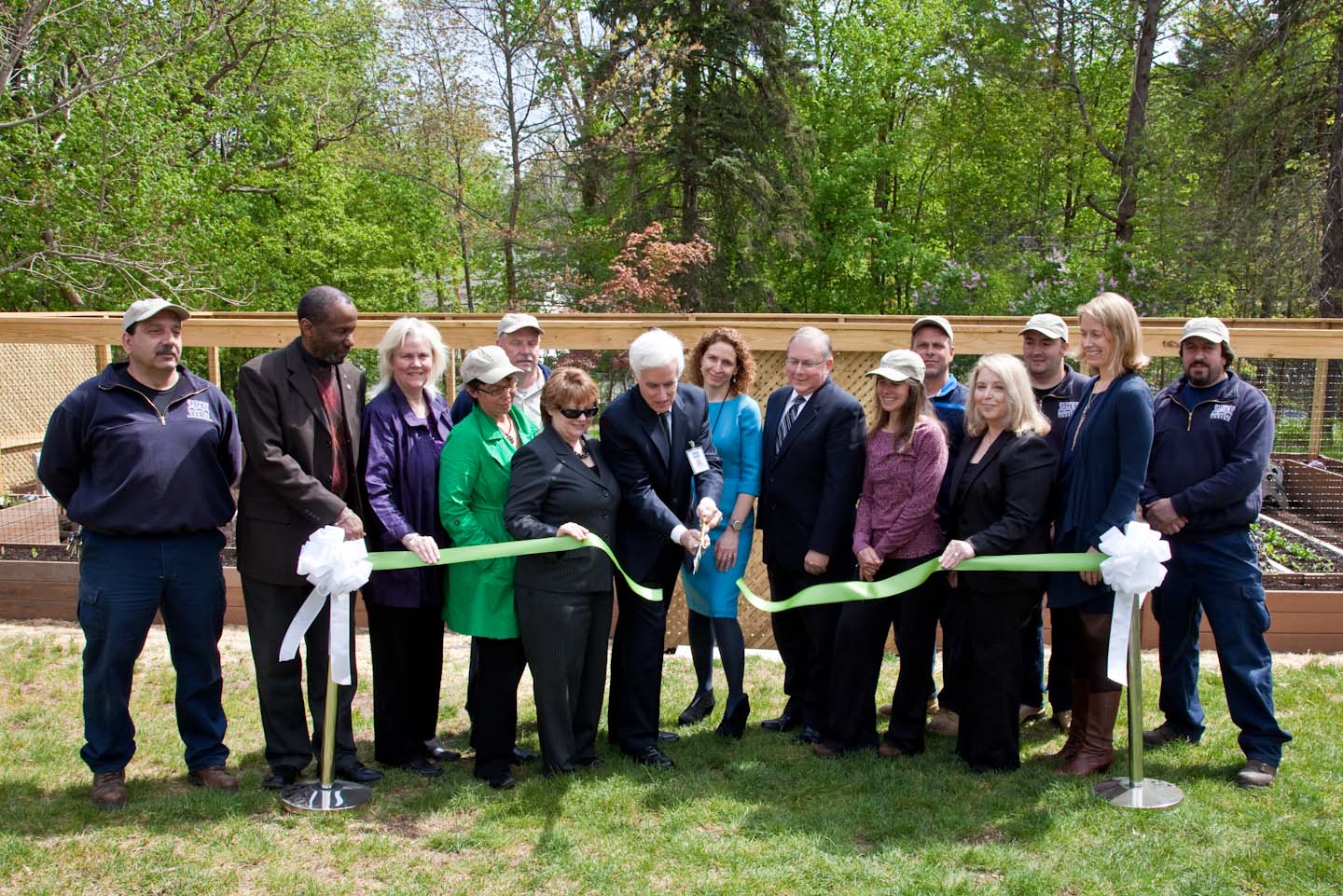 Hudson Valley Hospital President John Federspiel and Marisa Weiss, president and founder of Breastcancer.org, (center) dedicate new Organic Garden for Healing at Hudson Valley Hospital Center surrounded by garden volunteers, employees and donors who made the garden possible.