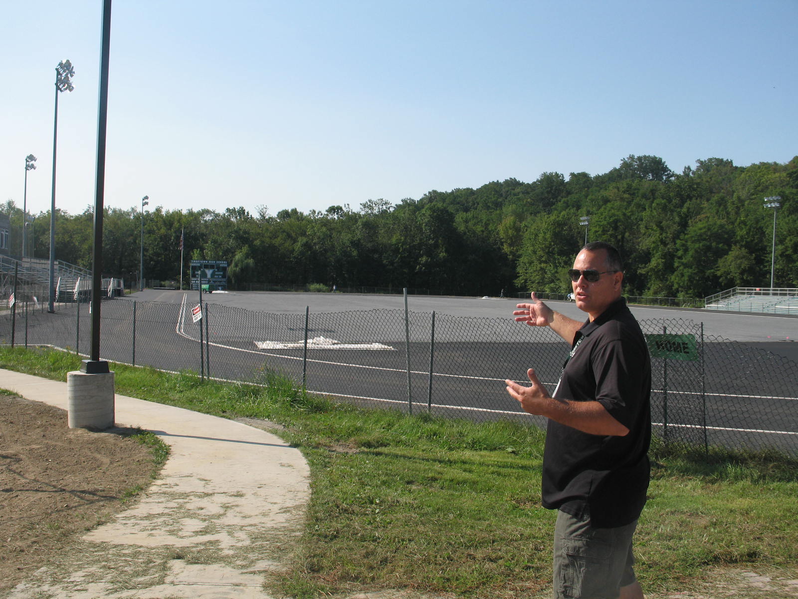 Assistant Superintendent of SchoolAssistant Superintendent of Schools Tom Cole shows work being done on athletic field at Yorktown High School.s Tom Cole shows work being done on athletic field at Yorktown High School.