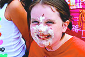 Pie eating contest is always a crowd pleaser at grange Fair.