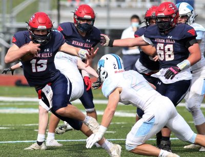 Byram Hills QB Hayden Fruhling, who threw for two touchdowns and ran one in, slips Westlake's Andrew Llamas in 35-14 win over Westlake in Class B championship game. | The Examiner News Section 1 Football Byram Hills