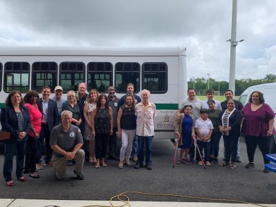 2021 NWE 0803 Yorktown Names Bus for Deceased Employee | The Examiner News Individuals standing with bus