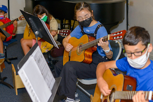 Children playing guitar