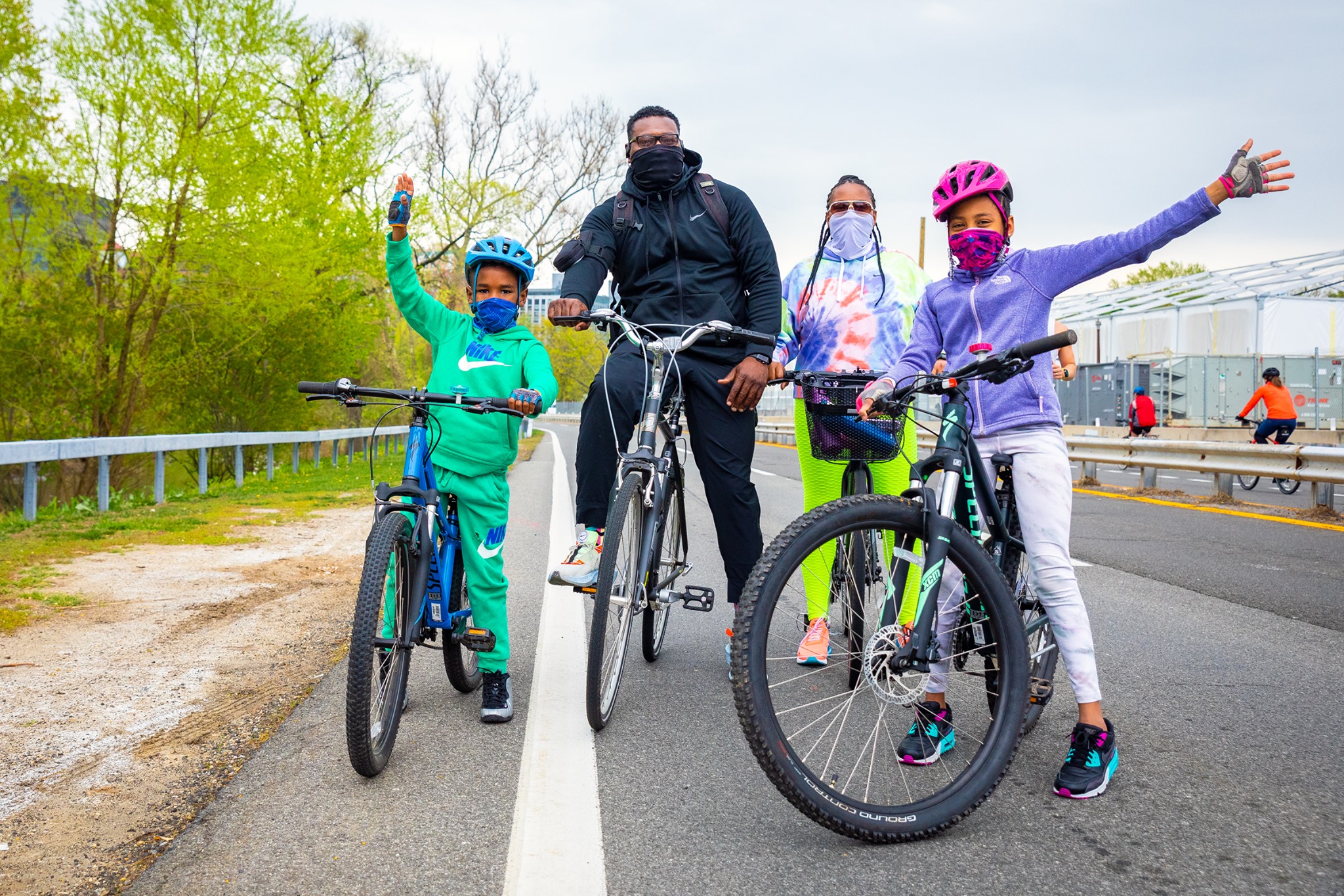 May be an image of one or more people, people riding bicycles, people standing, bicycle and outdoors