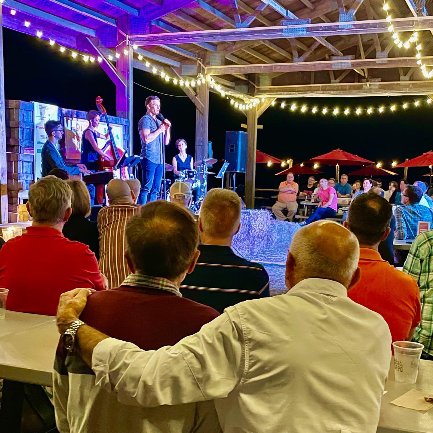 May be an image of one or more people, people standing, people playing musical instruments and outdoors