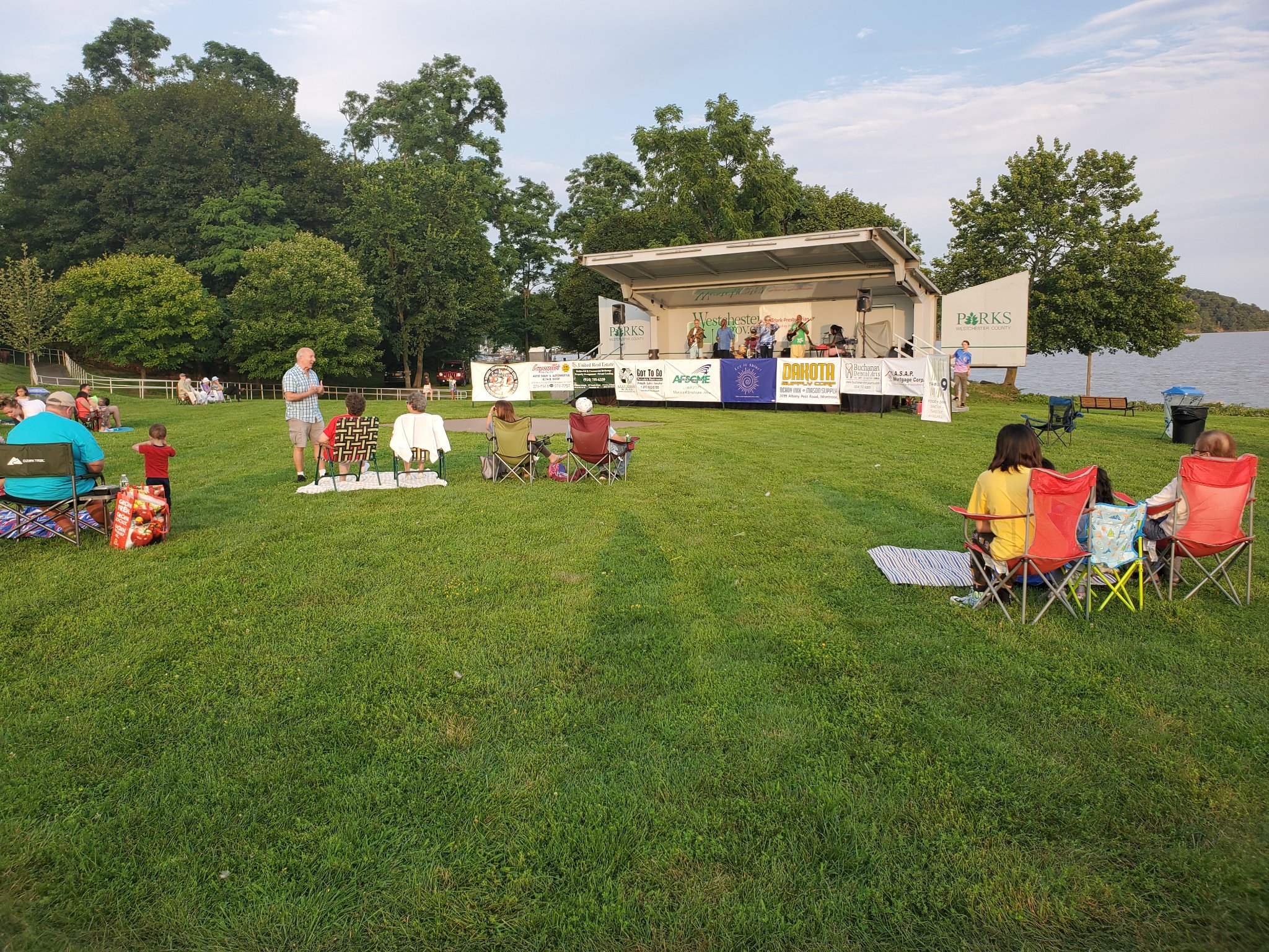 May be an image of 9 people, people standing and grass