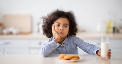 unhappy kid eating