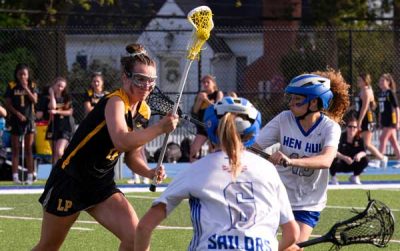 Lakeland-Panas-D-M-Lilly-Whippo-tries-to-split-Hen-Hud-defenders | The Examiner News