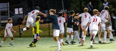 Fox-Lane-players-celebrate-the-Foxes-thrilling-Class-AA-quarterfinal-playoff-win | The Examiner News Fox Lane players celebrate