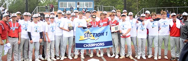 The 2025 Section 1 Class AA champion Foxes pose with the hardware | The Examiner News champion Foxes